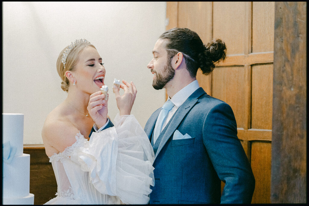 Veni Infantino and The groomsroom essex. Layer Marney Tower. The Iced Vegan wedding cake. Cake moment for bride and groom styled shoot. Tracey Davies Photography. 